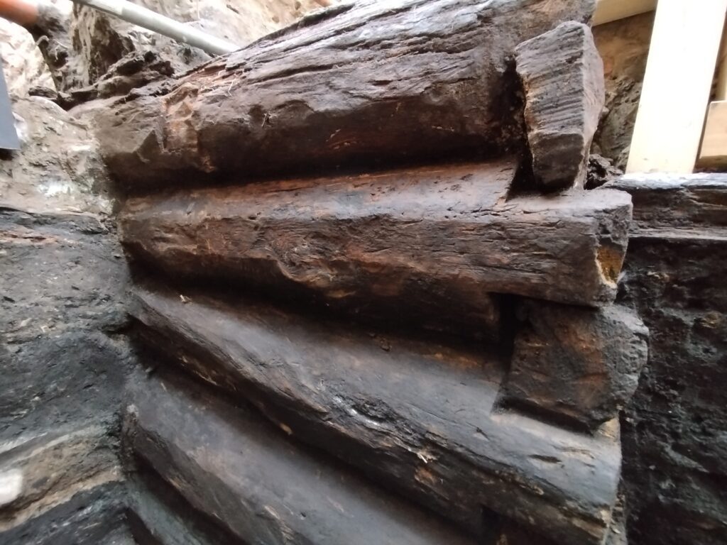 Hidden 13th-Century Wooden Structures Unearthed at Copernicus’ Family Home in Toruń