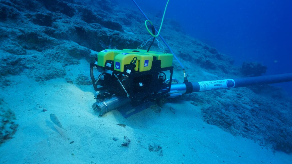 Underwater archaeologist recovering an ancient ceramic vessel from the Adrasan shipwreck.