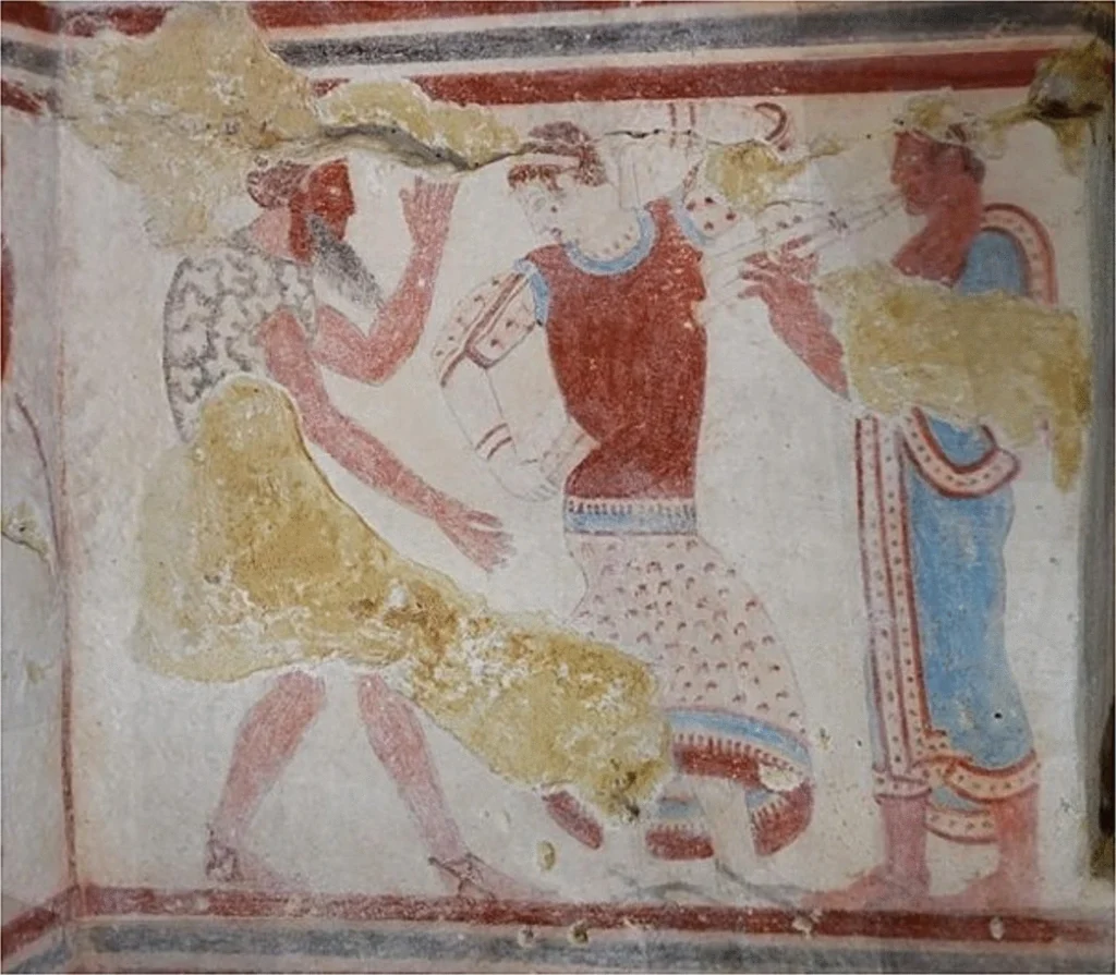 Masked dancers and a musician painted inside the Etruscan Tomba del Gallo at Tarquinia