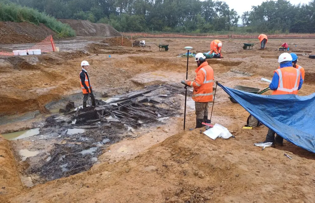 Archaeologists recording the timber structure of the Bronze Age waterhole