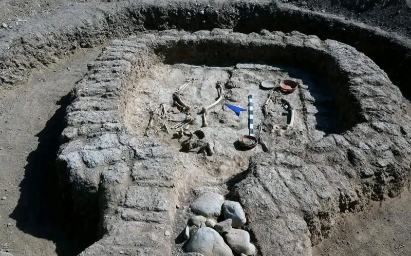 Excavated burial chamber containing human remains and pottery at Kyzylkol in southern Kazakhstan.