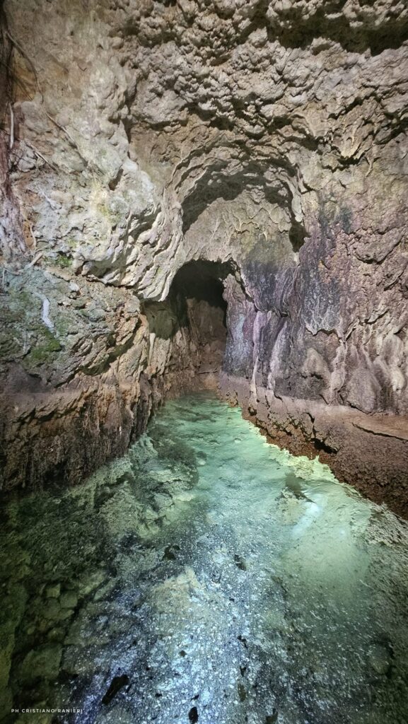 Pointed rock-cut passage and flowing water inside the pre-Roman Sabine aqueduct