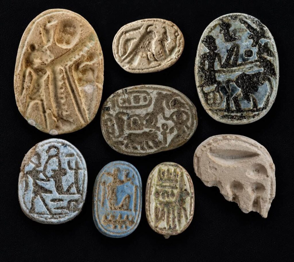 Decorated scarabs and amulets discovered inside the New Kingdom fortress at Tell el-Abqain.