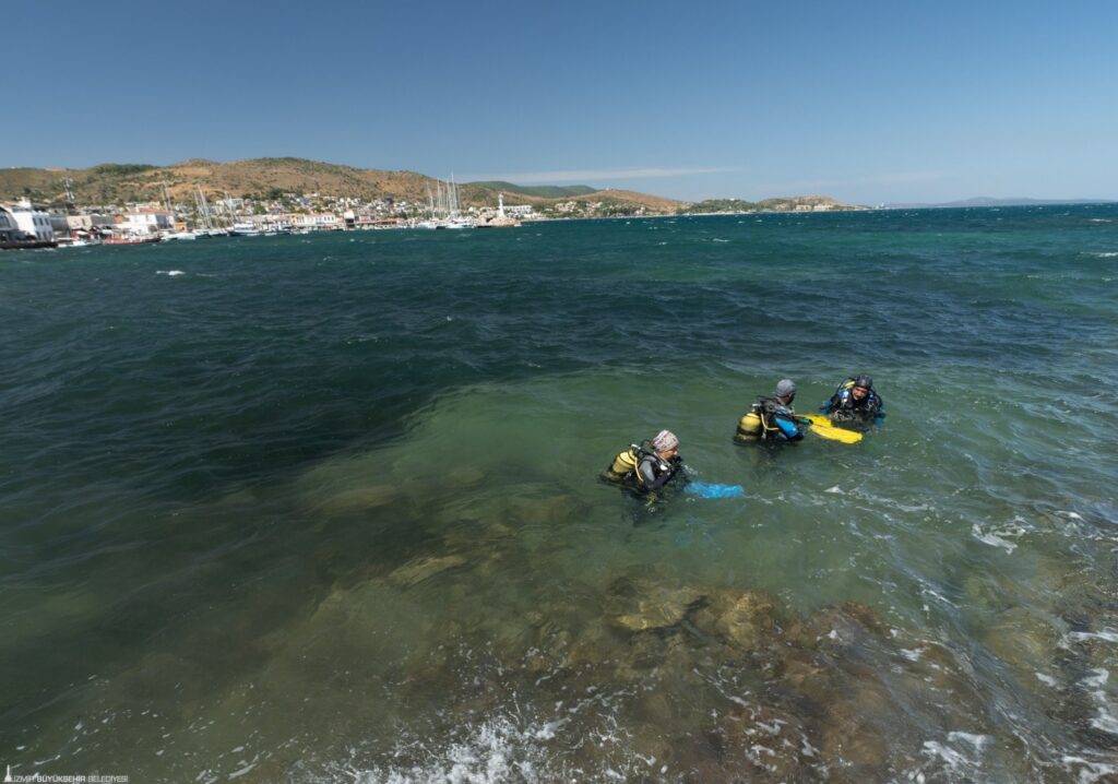 Archaeological divers investigating submerged remains in the waters off Liman Tepe