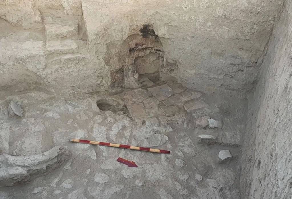 Fire-scarred ancient altar uncovered during excavations at Odirmon in Uzbekistan.