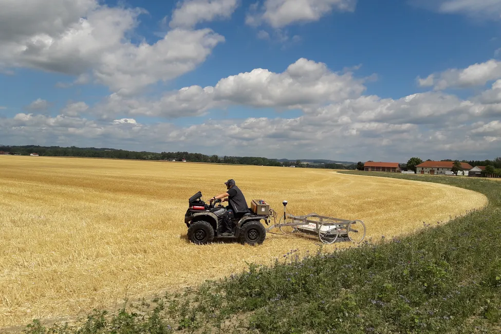 Survey equipment towed across a field during archaeological investigations near Stein, Austria.