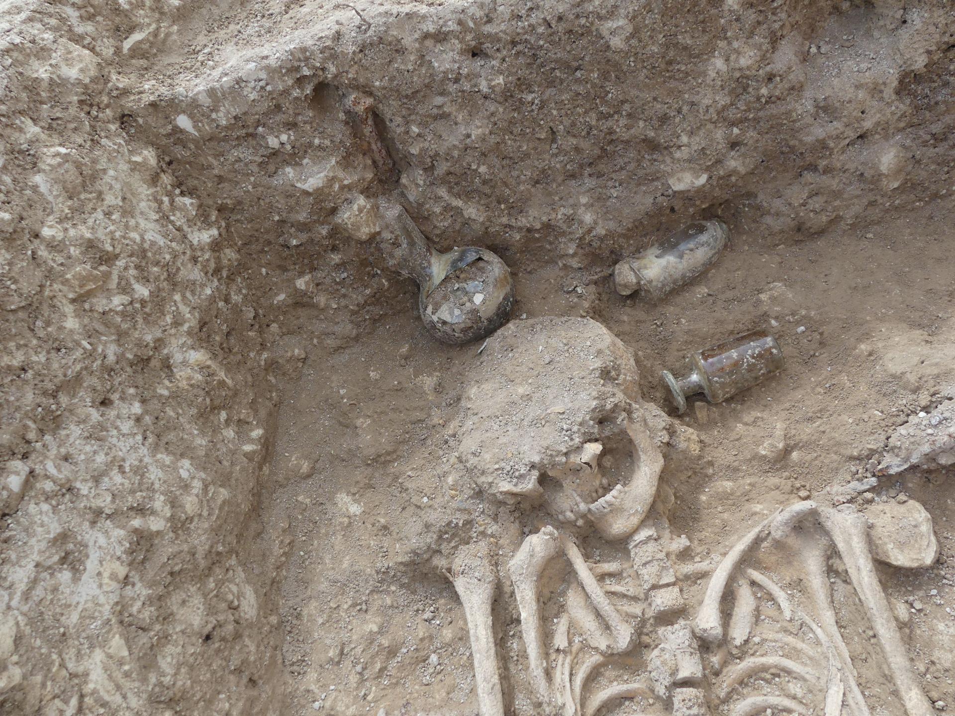 Late Roman skeleton with glass vessels placed near the head at La Rivière-de-Corps in France.