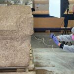 ntact 1,800-year-old Roman child's stone sarcophagus being documented by archaeologists in Constanța, Romania.