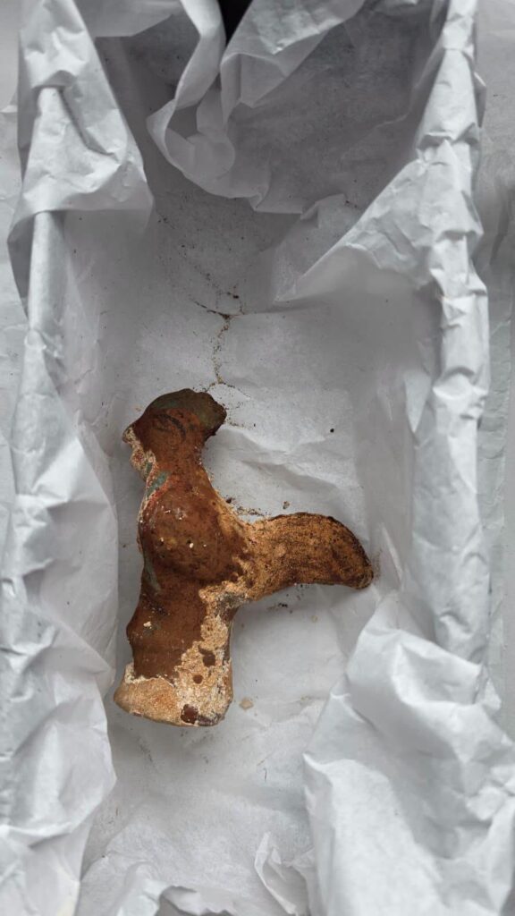 Roman terracotta rooster-shaped rattle found inside a 1,800-year-old child's sarcophagus in Romania.