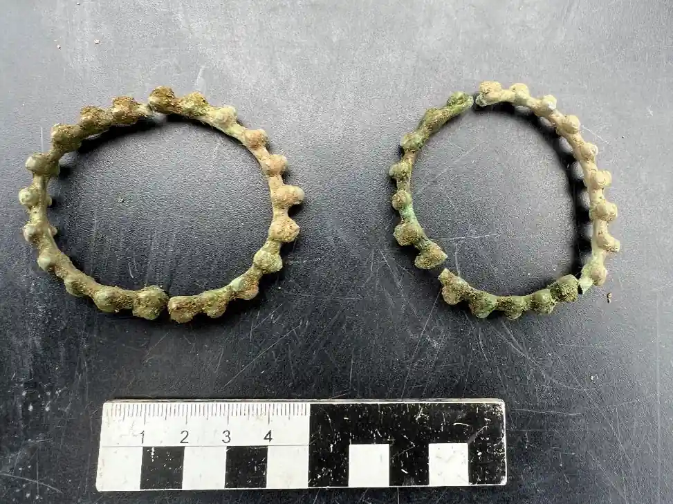 Two ancient bronze rings with raised knot-shaped decorations found in a Celtic woman's grave in Bavaria.