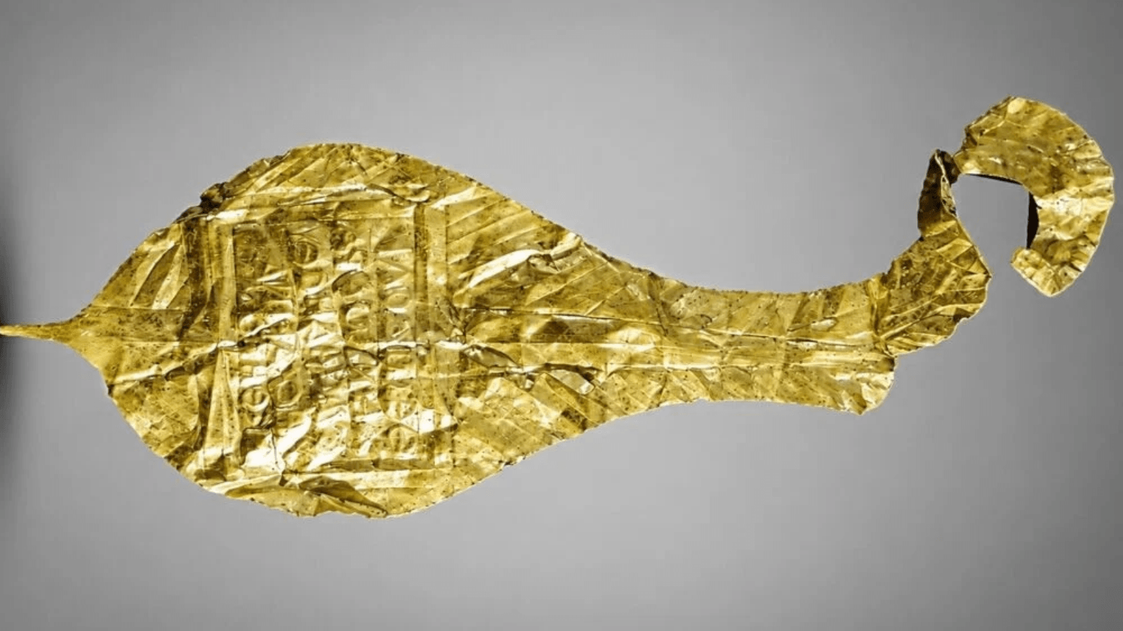 Ancient gold votive plaque with a Greek inscription dedicated to Jupiter Dolichenus, discovered at the Roman fort of Apsaros in Georgia.
