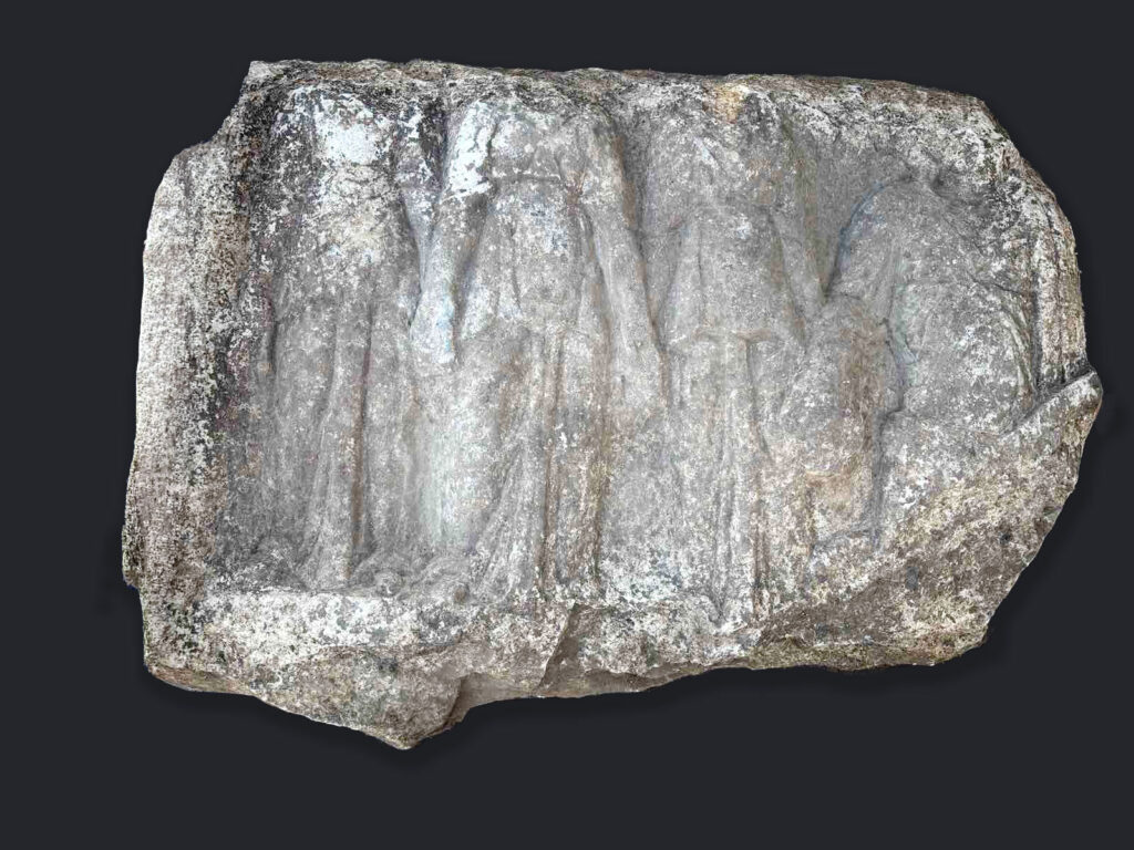 Weathered ancient marble relief depicting Cybele and three nymphs from the Thracian sanctuary at Balak Dere, Bulgaria.