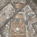 Aerial view of the excavated Thracian pagan temple at Balak Dere in Bulgaria, showing its trapezoidal architectural plan.