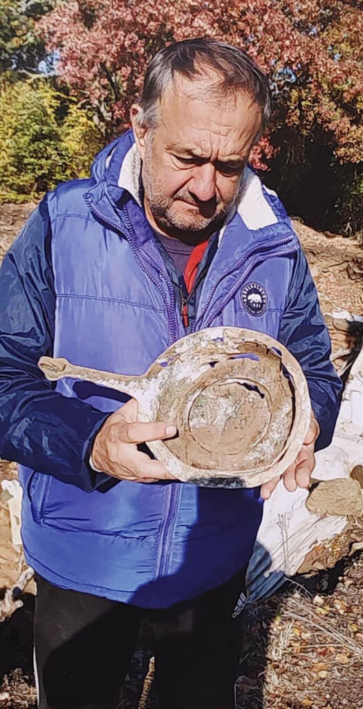 Bulgarian archaeologist Ivaylo Kanev holding an archaeological artifact during excavations at Balak Dere near Ivaylovgrad.