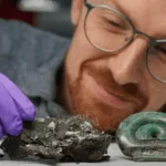 Dr Matthew Knight examining Bronze Age objects from the Blyth Hoard in Scotland.