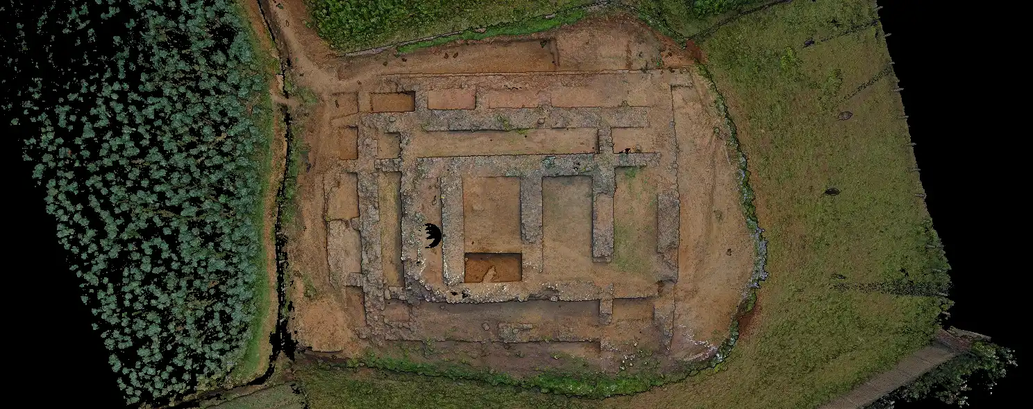 Aerial photograph showing the excavated layout and stone foundations of the Jandial D archaeological site in Pakistan.