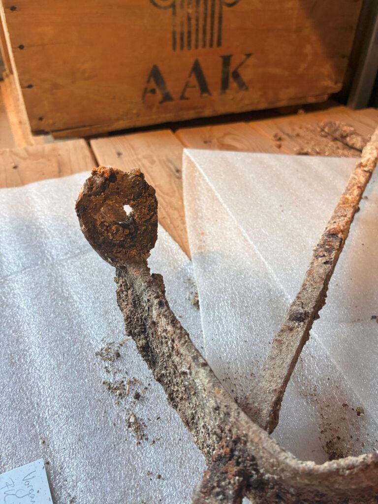 Close-up of a corroded iron attachment ring on a Roman window grille discovered in Switzerland.