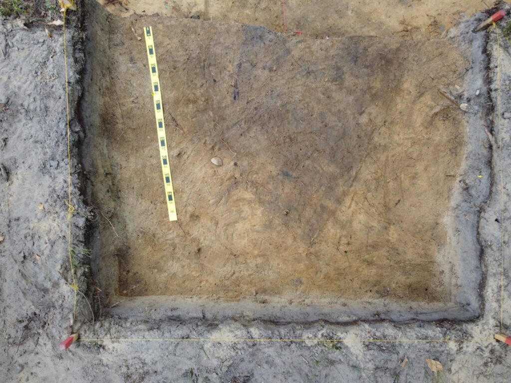 A detailed view of the excavation site of the boat grave in Chodlik. A dark soil stain was documented.