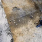 The archaeologist is conducting a detailed documentation project by marking the locations of the finds in the boat grave at Chodlik.The archaeologist is conducting a detailed documentation project by marking the locations of the finds in the boat grave at Chodlik.